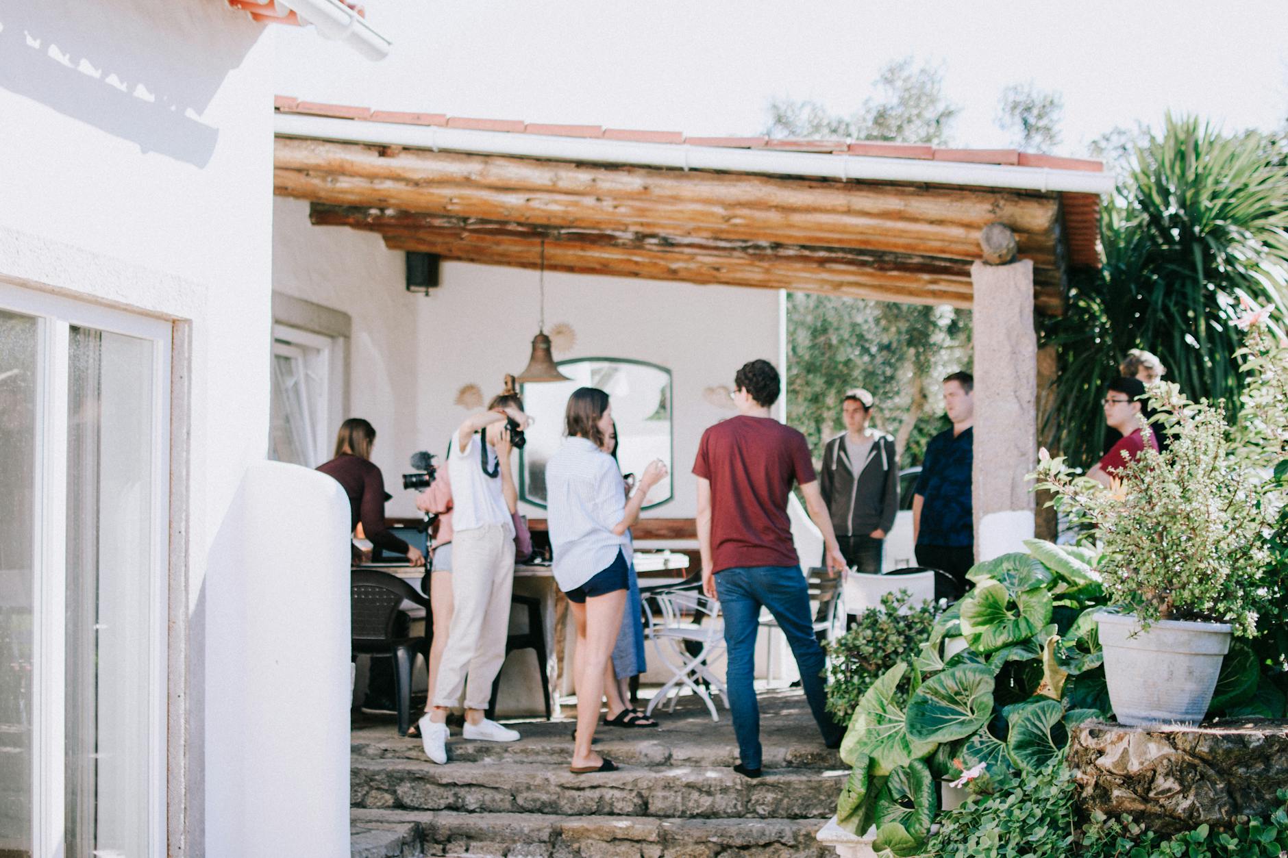 people standing under the awning