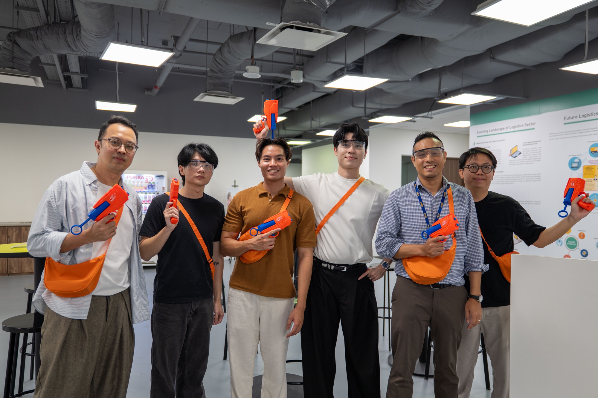 YSG teammates posing together with NERF blasters.